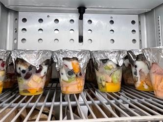 Fruit cups in the refrigerator.